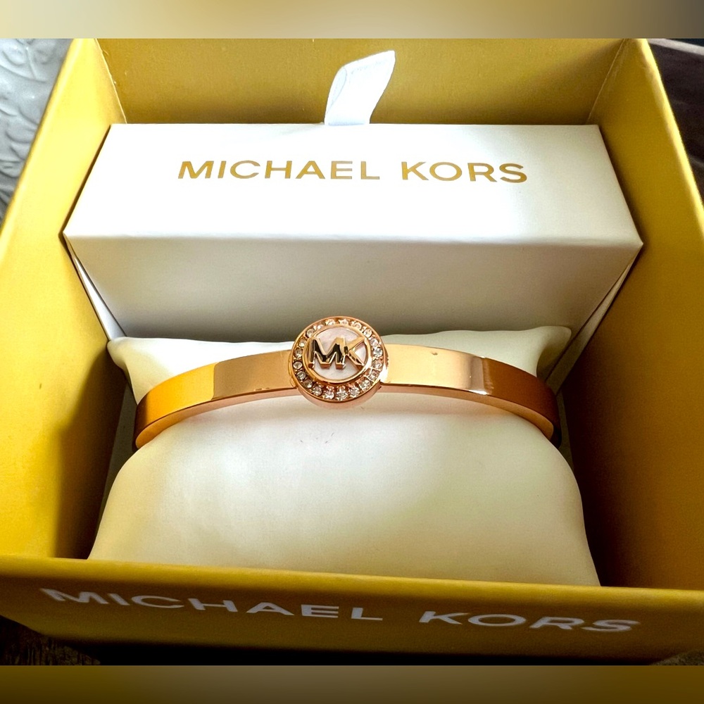 Michael Kors bangle gold with MK logo surrounded by stones